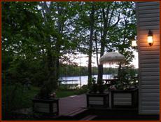 This view, including the lake in the background, greets visitors approaching the deck from the driveway.