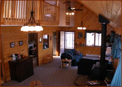 Great Room, from Studio area, looking towards living room, deck, and kitchen, and balcony/loft above.