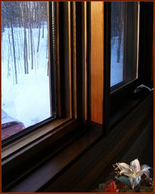 Close-up of solid California Redwood window frame, and TRIPLE glazed window lites.